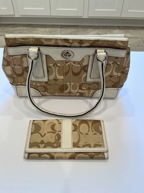 Beige Logo-Pattern Tote Handbag with White Trim and matching wallet.